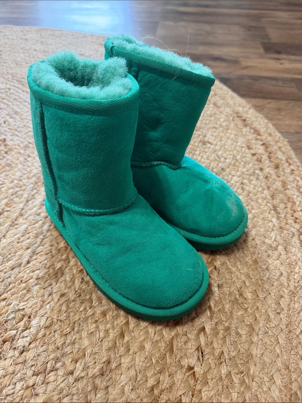 UGG Kids' Classic Short II boots in a  emerald green genuine shearling lining.